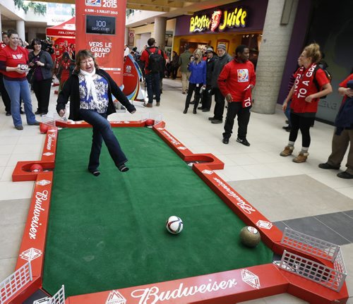 To mark the beginning of the 100 Day Countdown to the FIFA Womens World Cup, Canada 2015, Lucy Muswagon had the opportunity to play Poolball in the Winnipeg Square Thursday for a  chance to win a pair of tickets and was successful. February 26 also marks the day when the general public has their chance to secure their seat as individual tickets for Canada 2015 are going on sale for $20.15. see release emailed  Wayne Glowacki/Winnipeg Free Press Feb.26   2015