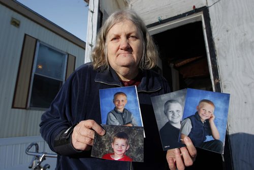NEWS - KANE FIRE FOLLOW- MORDEN, MB - Beverley Eberhardt, grandmother to the 4 boys that died in the fire. Left top, Timmy, Left bottom, Henry, middle b&w Bobby, and Right Danny.  BORIS MINKEVICH/WINNIPEG FREE PRESS FEB. 26, 2015