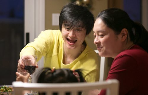 Liang Xing toasts with his daughter and wife Kerr who moved from Beijing to join Liang in Winnipeg.   150219 - Thursday, February 19, 2015 - (Melissa Tait / Winnipeg Free Press)
