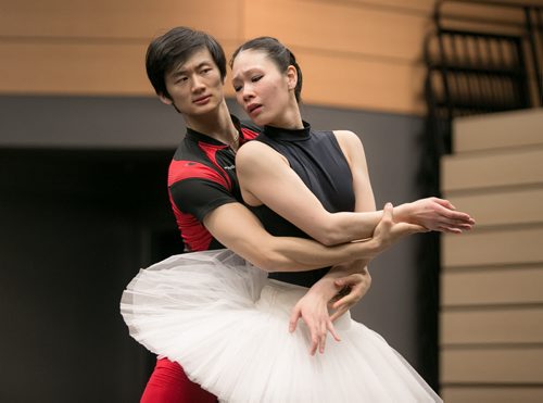 Xing glances into the mirror to check his position while rehearsing the pas de deux in Swan Lake with soloist Sophia Lee.  150220 - Friday, February 20, 2015 - (Melissa Tait / Winnipeg Free Press)