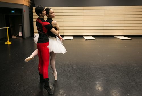 Xing with soloist Sophia Lee while rehearsing the pas de deux from Swan Lake. 150220 - Friday, February 20, 2015 - (Melissa Tait / Winnipeg Free Press)