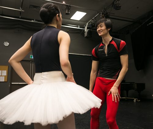 Xing laughs with soloist Sophia Lee while rehearsing the pas de deux from Swan Lake.   150220 - Friday, February 20, 2015 - (Melissa Tait / Winnipeg Free Press)