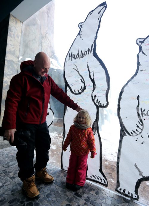 Michael Mullen and his grand daughter, Livinia Bradbury, 3, at the Gateway to the Arctic building at the Assiniboine Park Zoo in front of an art installation by Kal Barteski which is part of special Polar Bear Day celebrations, Saturday, February 28, 2015. (TREVOR HAGAN/WINNIPEG FREE PRESS)