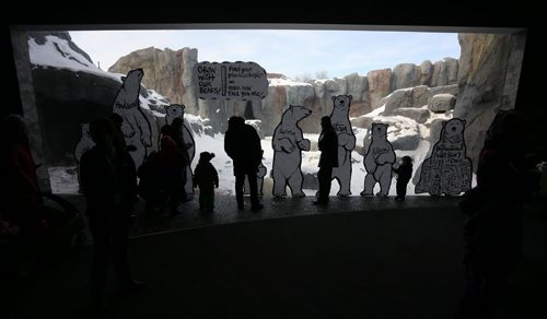 Visitors to the Gateway to the Arctic building at the Assiniboine Park Zoo in front of an art installation by Kal Barteski which is part of special Polar Bear Day celebrations, Saturday, February 28, 2015. (TREVOR HAGAN/WINNIPEG FREE PRESS)