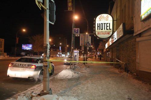 Police tape off sidewalk in front of the Yale Hotel on Main Street Saturday night,  Feb. 28, 2015 Ruth Bonneville / Winnipeg Free Press.