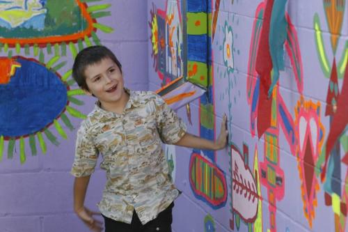 John Woods / Winnipeg Free Press / October 1/07- 071001  - Gabe Krawel, a young artist who participated in the creation of a new UN sponsored mural at Art City, checks out the mural during an unveiling ceremony Monday October 1/07.