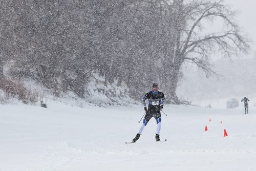 Steve Scoles works his way to the finish line for the win as a burst of heavy snowfall begins during the Olympia St. Marys Winter Triathlon Sunday morning on the Red River Trail. The race consists of a 2KM snowshoe, a 5KM skate and a 5KM ski and around 36 hardy souls took part.  150301 March 01, 2015 Mike Deal / Winnipeg Free Press