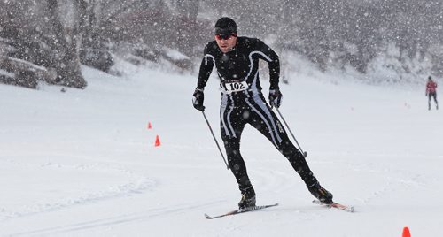 Murray Carter works his way to the finish line for the second place spot as a burst of heavy snowfall begins during the Olympia St. Marys Winter Triathlon Sunday morning on the Red River Trail. The race consists of a 2KM snowshoe, a 5KM skate and a 5KM ski and around 36 hardy souls took part.  150301 March 01, 2015 Mike Deal / Winnipeg Free Press