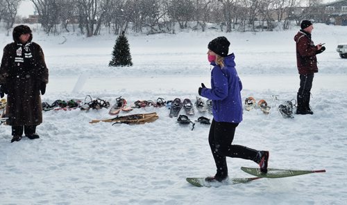 A participant in snowshoes approaches the switching point during the Olympia St. Marys Winter Triathlon Sunday morning on the Red River Trail. The race consists of a 2KM snowshoe, a 5KM skate and a 5KM ski and around 36 hardy souls took part.  150301 March 01, 2015 Mike Deal / Winnipeg Free Press