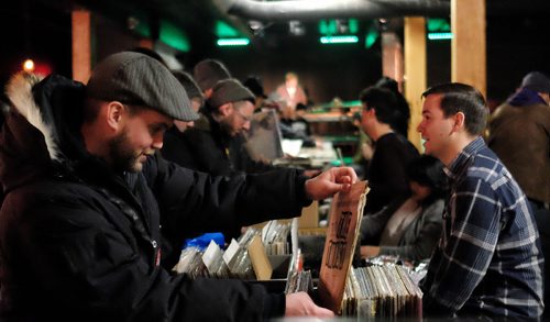 A steady stream of vinyl lovers browse through the offerings at the Central City Record Show at Union Sound Hall Sunday afternoon.  150301 March 01, 2015 Mike Deal / Winnipeg Free Press