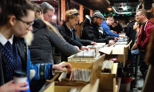 A steady stream of vinyl lovers browse through the offerings at the Central City Record Show at Union Sound Hall Sunday afternoon.  150301 March 01, 2015 Mike Deal / Winnipeg Free Press