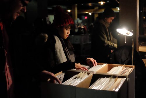 Maricar Remoto was among a steady stream of vinyl lovers browsing through the offerings at the Central City Record Show at Union Sound Hall Sunday afternoon.  150301 March 01, 2015 Mike Deal / Winnipeg Free Press