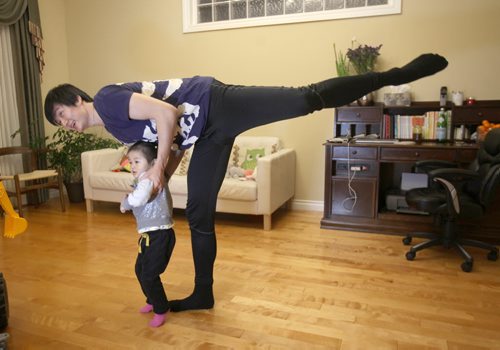 Liang Xing RWB principal male  with his 2 yr old  daughter Vivian Xing in his Winnipeg home See Tait,Bryksa,Zoratti feature - Feb, 2015   (JOE BRYKSA / WINNIPEG FREE PRESS)