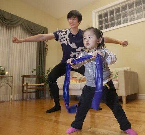 Liang Xing RWB principal male  with his 2 yr old daughter Vivian Xing in his Winnipeg home See Tait,Bryksa,Zoratti feature - Feb, 2015   (JOE BRYKSA / WINNIPEG FREE PRESS)