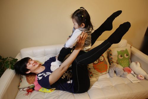 Liang Xing RWB principal male  with his 2 yr old daughter Vivian Xing in his Winnipeg home See Tait,Bryksa,Zoratti feature - Feb, 2015   (JOE BRYKSA / WINNIPEG FREE PRESS)