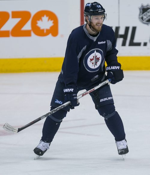Winnipeg Jets' Brian Little efence Tyler Myers during practice Monday.  150302 - Monday, March 02, 2015 - (Melissa Tait / Winnipeg Free Press)