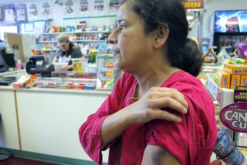 NEWS - Bergie's convenience store in Beausejour. Assault victim Tanu Mukherjee in the store on Monday morning. Here she shows her bruise on her arm.  BORIS MINKEVICH/WINNIPEG FREE PRESS MARCH 2, 2015