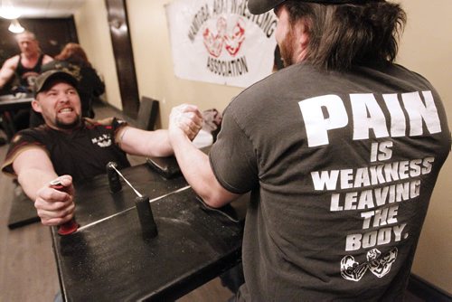 February 4, 2015 - 150204  -  Michael Barrett (R) and  Rob Low pull during a match during a Manitoba Arm Wrestling Association practise Wednesday, February 4, 2015. John Woods / Winnipeg Free Press