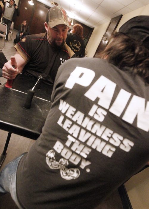 February 4, 2015 - 150204  -  Michael Barrett (R) and  Rob Low pull during a match during a Manitoba Arm Wrestling Association practise Wednesday, February 4, 2015. John Woods / Winnipeg Free Press