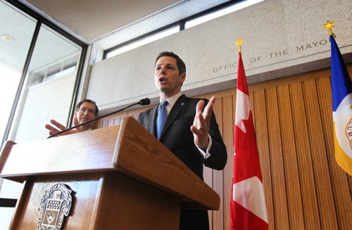 Winnipeg Mayor Brian Bowman talks to the press after unveiling the new City Budget for 2015 at City Hall Tuesday afternoon.  Tuesday,  March 03, 2015 Ruth Bonneville / Winnipeg Free Press.