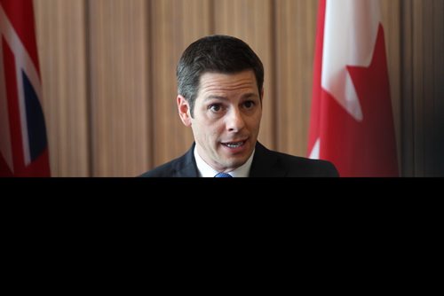 Winnipeg Mayor Brian Bowman talks to the press after unveiling the new City Budget for 2015 at City Hall Tuesday afternoon.  Tuesday,  March 03, 2015 Ruth Bonneville / Winnipeg Free Press.