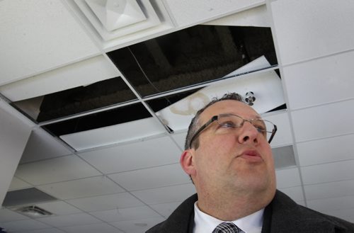 Andrew Konowalchuk chair of Triple B Stadium Inc announced that today they will file a lawsuit  in the Court of Queens Bench against architect and contactor for repairs required to the two year old Investors Group Field   He shows damaged tiles in luxury suite-See Kives story- Feb 26, 2015   (JOE BRYKSA / WINNIPEG FREE PRESS)
