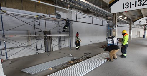 Triple B Stadium Inc announced that today they will file a lawsuit in the Court of Queens Bench against architect and contactor for repairs required to the two year old Investors Group Field   Here workers install insulation-See Kives story- Feb 26, 2015   (JOE BRYKSA / WINNIPEG FREE PRESS)