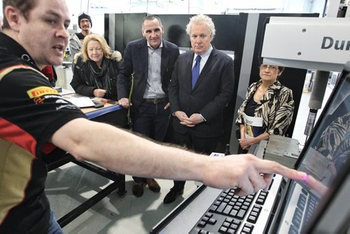 Colin Doyle (left) a Machine Instructor explains how a CMM or Computer Measuring Machin works to (l-r) Dorothy Dobbie former MP,  MLA Kevin Chief, Jean Charest former Canadian heritage minister, and Marileen Bartlett executive director at the Centre for Aboriginal Human Resource Development Inc., during a tour of the Neeginan Centre (formerly the Aboriginal Centre of Winnipeg).  150304 March 04, 2015 Mike Deal / Winnipeg Free Press
