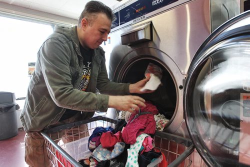 Elder De Andrade in his laundromat, The Washeteria, at 556 Keenleyside Street. 150304 March 04, 2015 Mike Deal / Winnipeg Free Press