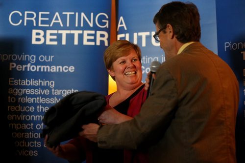 Kim Westenskow, GM of Boeing Canada, receiving a sweat shirt from Larry Switzer, President of the Winnipeg Optimist Athletics Club, at a press conference for the upcoming 34th Boeing Classic, Manitoba Indoor Track and Field Championships, which will take place in the newly named James Daly Field House at Max Bell Centre, at the University of Manitoba, Wednesday, March 4, 2015. (TREVOR HAGAN/WINNIPEG FREE PRESS)