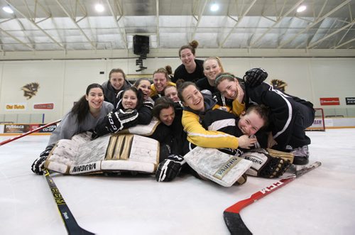 University of Manitoba Bison Women's Hockey Team have some fun after posing for a group photo after practice Thursday morning before boarding a plane for Edmonton to compete in the Canada West Championship this weekend.   Thursday,  March 05, 2015 Ruth Bonneville / Winnipeg Free Press.