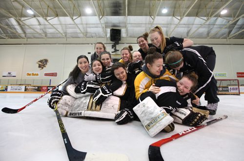 University of Manitoba Bison Women's Hockey Team have some fun after posing for a group photo after practice Thursday morning before boarding a plane for Edmonton to compete in the Canada West Championship this weekend.   Thursday,  March 05, 2015 Ruth Bonneville / Winnipeg Free Press.