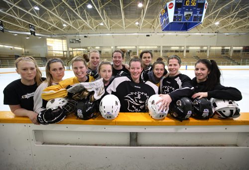 University of Manitoba Bison Women's Hockey Team pose for a group photo after practice Thursday morning before boarding a plane for Edmonton to compete in the Canada West Championship this weekend.   Thursday,  March 05, 2015 Ruth Bonneville / Winnipeg Free Press.