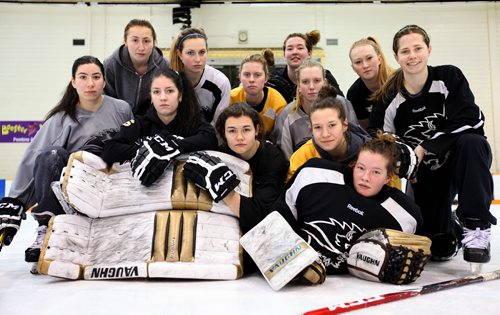 University of Manitoba Bison Women's Hockey Team pose for a group photo after practice Thursday morning before boarding a plane for Edmonton to compete in the Canada West Championship this weekend.   Thursday,  March 05, 2015 Ruth Bonneville / Winnipeg Free Press.