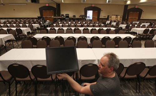 Troy McKenzie of Benmarks from Brandon, Manitoba sets up audio/visual equipment at Canad Inns Polo Park for the opening tonight of the NDP leadership convention. The convention is expected to draw nearly 1500 delegates and over 100 media for the weekend. It will wrap up Sunday night with the completion of the leadership vote  - Mar 06, 2015   (JOE BRYKSA / WINNIPEG FREE PRESS)