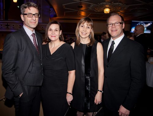 The fifth annual Savour: Wine and Food Experience was held at the Metropolitan Entertainment Centre on Feb. 28, 2015. The theme was old Hollywood, and the event was hosted by actor Billy Baldwin. Funds from the event support research, education, advanced technology and infrastructure enhancements at Health Sciences Centre. Pictured, from left, are Ted Bock, Liane Bock, Megan Adams and Marty Fisher. (JOHN JOHNSTON / WINNIPEG FREE PRESS)