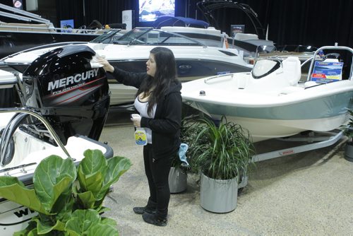 The Mid-Canada Boat Show (also referred to as the Winnipeg Boat Show) at the RBC Convention Centre. Hired detailer Sarena Neiman polishes up a boat at the show. BORIS MINKEVICH/WINNIPEG FREE PRESS MARCH 6, 2015