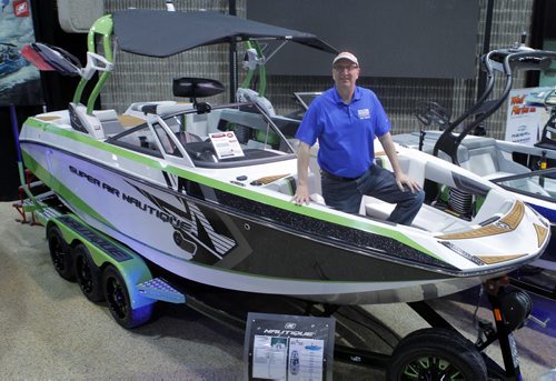 The Mid-Canada Boat Show (also referred to as the Winnipeg Boat Show) at the RBC Convention Centre. Dave Trade Show Dave Amey in a $156,900 ski boat. BORIS MINKEVICH/WINNIPEG FREE PRESS MARCH 6, 2015
