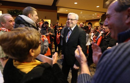 Premier Greg Selinger arrives to a warm welcome by supporters including Judy WL at the NDP Convention at CanadInns Polo Park, Friday, March 6, 2015. (TREVOR HAGAN/WINNIPEG FREE PRESS)
