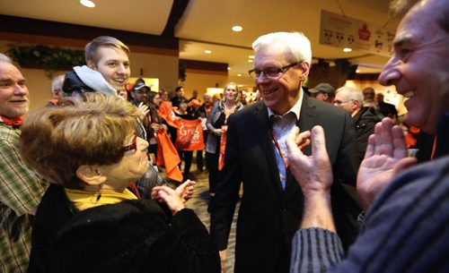 Premier Greg Selinger arrives to a warm welcome by supporters including Judy WL at the NDP Convention at CanadInns Polo Park, Friday, March 6, 2015. (TREVOR HAGAN/WINNIPEG FREE PRESS)