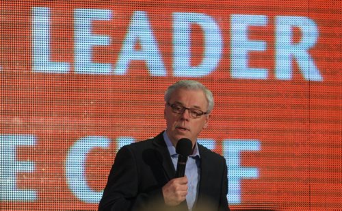 Greg Selinger enters the hall to give his final speech before the delegates vote for their leader sunday morning at the NDP Convention at Canad Inns Polo Park. 150308 - Sunday, March 08, 2015 -  (MIKE DEAL / WINNIPEG FREE PRESS)