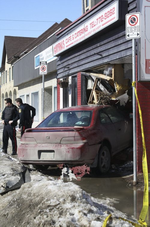 A Honda Accord took the term "drive-thru" too literally at Myrnas Café & Catering on Sargent Avenue Sunday morning. March 8, 2015. Jessica Bothelo-Urbanski / Winnipeg Free Press