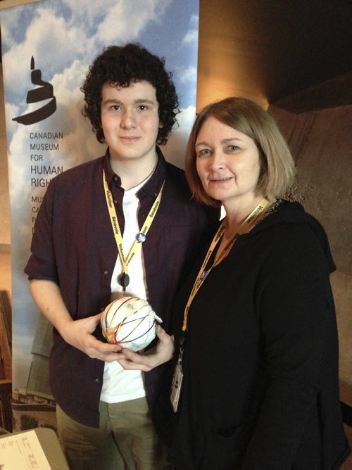 Braden McMillan, 14,¤ and his mom Brenda Kelly volunteered at the Canadian Museum for Human Rights on Sunday where they made¤ soccer balls out of plastic bags and newspaper, as is done in some less fortunate areas of the world where children do not have toys and they talked to kids visiting the CMHR and the soccer-ball station about ¤about the Right To Play. It was all part of the International Womens Day/Countdown to FIFA Womens World Cup 2015 at the CMHR during which members of the public were able to attend three presentations related to the upcoming Womens World Cup being hosted by Canada and including games in Winnipeg. March 8, 2015. Ashley Prest / Winnipeg Free Press