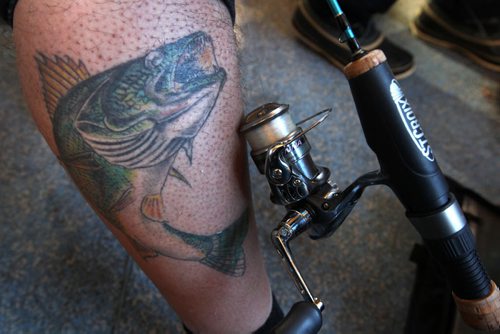 Fishing guide Todd Longley shows off his walleye tattoo in a ice hut on Lake Winnipeg aprx 45 km north of Winnipeg-Mellisa Tait/Bryksa ice fishing feature story  Apr, 2015   (JOE BRYKSA / WINNIPEG FREE PRESS)