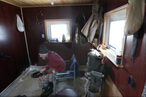 Kenny Wollman in his ice hut on  Lake Winnipeg aprx 45 km north of Winnipeg - see Mellisa Tait/Bryksa ice fishing feature story  Apr, 2015   (JOE BRYKSA / WINNIPEG FREE PRESS)