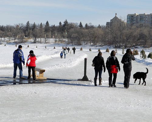 The Red River skating trail is now closed. Many walkers still occupy the frozen slush trail. BORIS MINKEVICH/WINNIPEG FREE PRESS MARCH 9, 2015