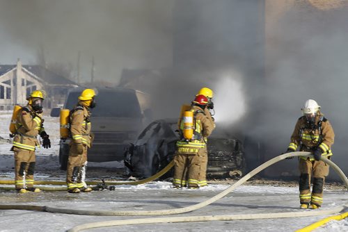 March 9, 2015 - 150309  -  Fire destroys a home at 3169 Pipeline Road Monday, March 9, 2015. John Woods / Winnipeg Free Press