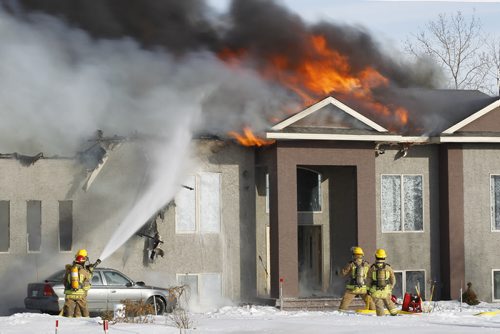 March 9, 2015 - 150309  -  Fire destroys a home at 3169 Pipeline Road Monday, March 9, 2015. John Woods / Winnipeg Free Press