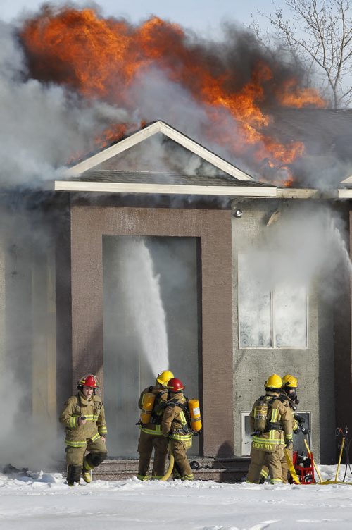 March 9, 2015 - 150309  -  Fire destroys a home at 3169 Pipeline Road Monday, March 9, 2015. John Woods / Winnipeg Free Press