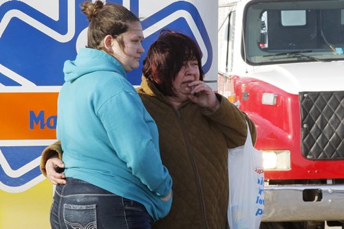 March 9, 2015 - 150309  -  Residents watch as a fire destroys a home at 3169 Pipeline Road Monday, March 9, 2015. John Woods / Winnipeg Free Pressf